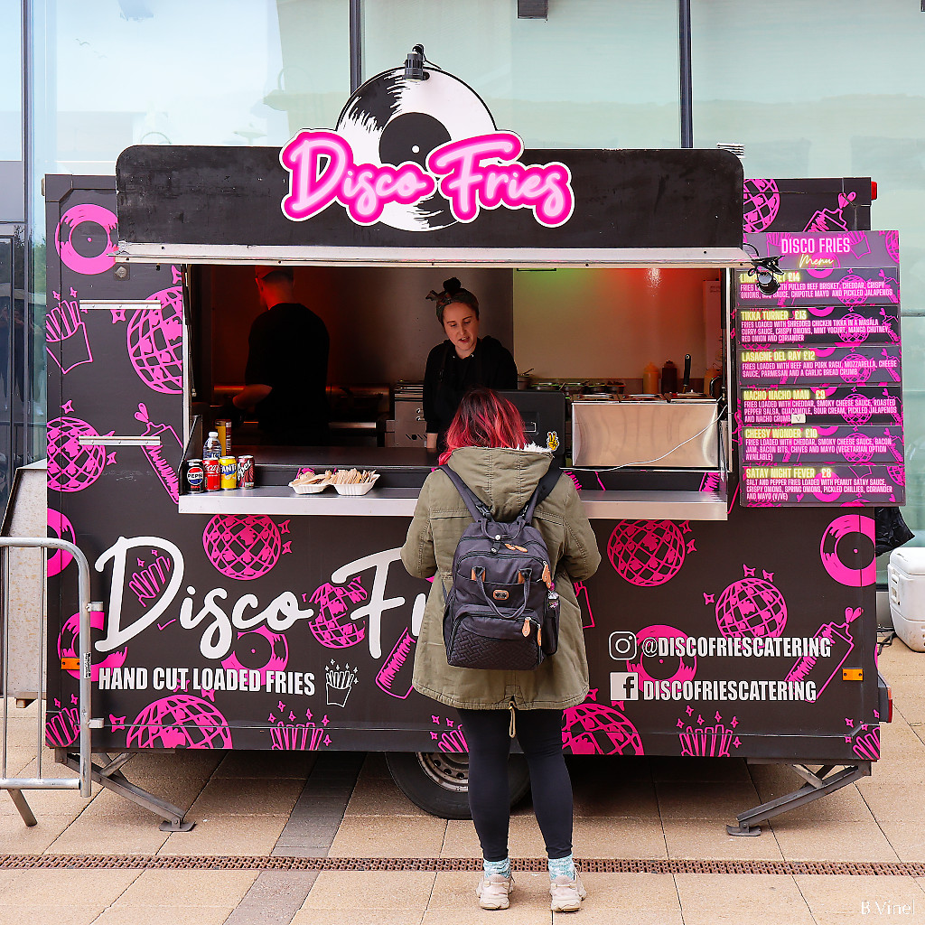 Disco Fries street food van with a customer being served
